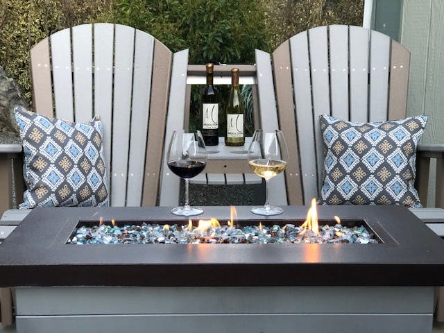 Polywood Adirondack outdoor Swivel Glider rocking Chair with champagne bottle and glasses