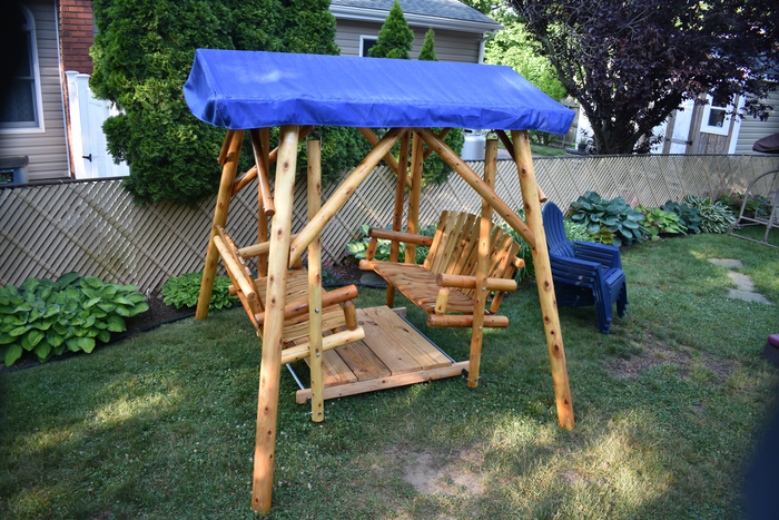 moon valley rustic outdoor cedar log double glider varnished with royal blue canopy