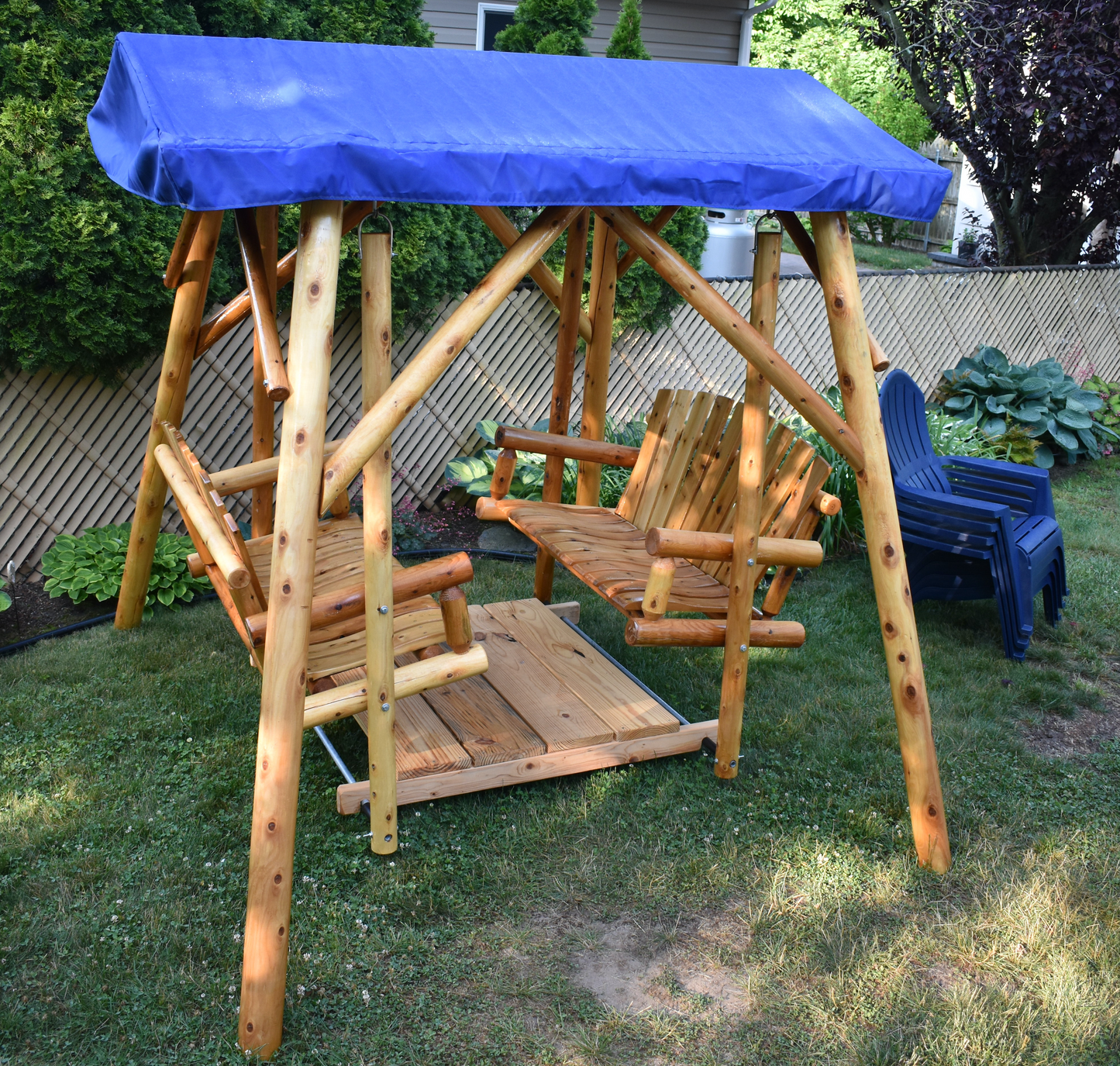 moon valley rustic outdoor cedar log double glider varnished with royal blue canopy